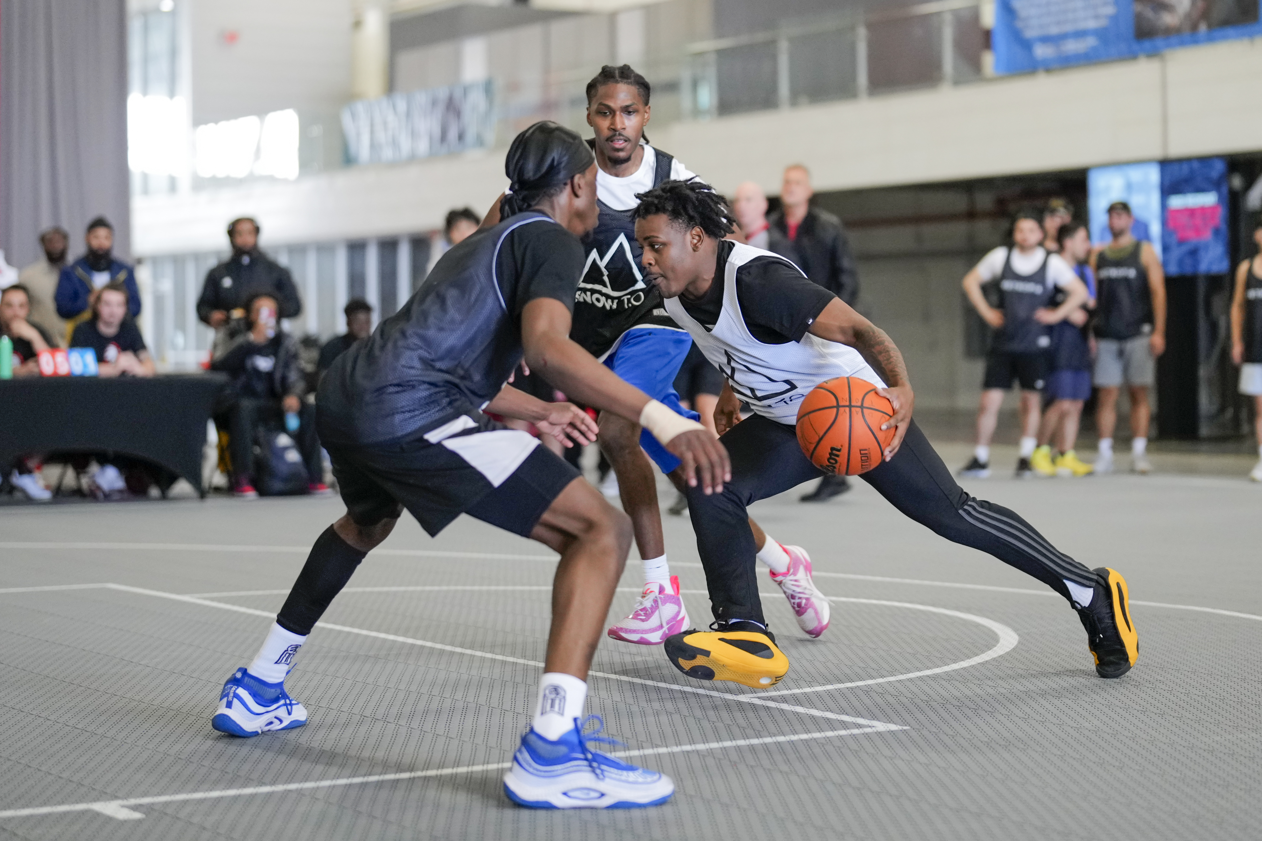 two players holding up a raptors jersey